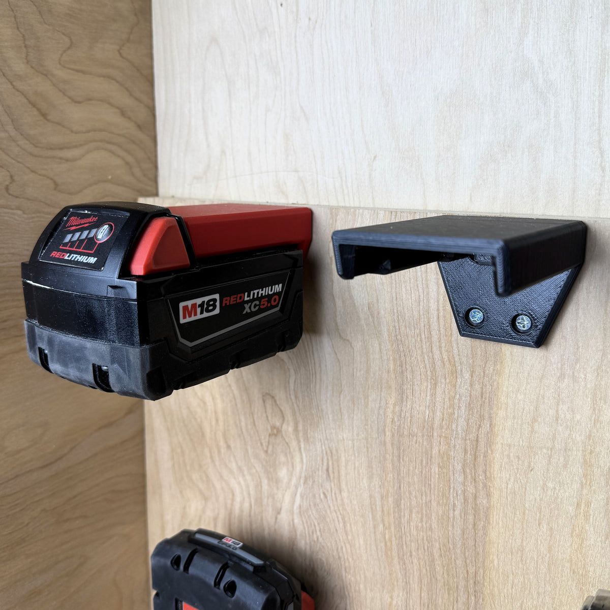 Milwaukee M18 battery in a horizontal wall mount