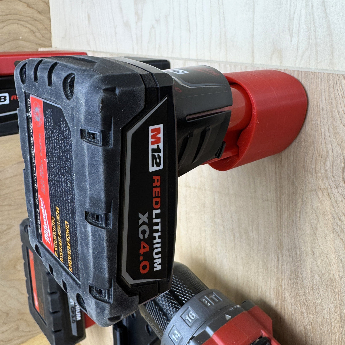 Milwaukee M12 battery in a wall mount